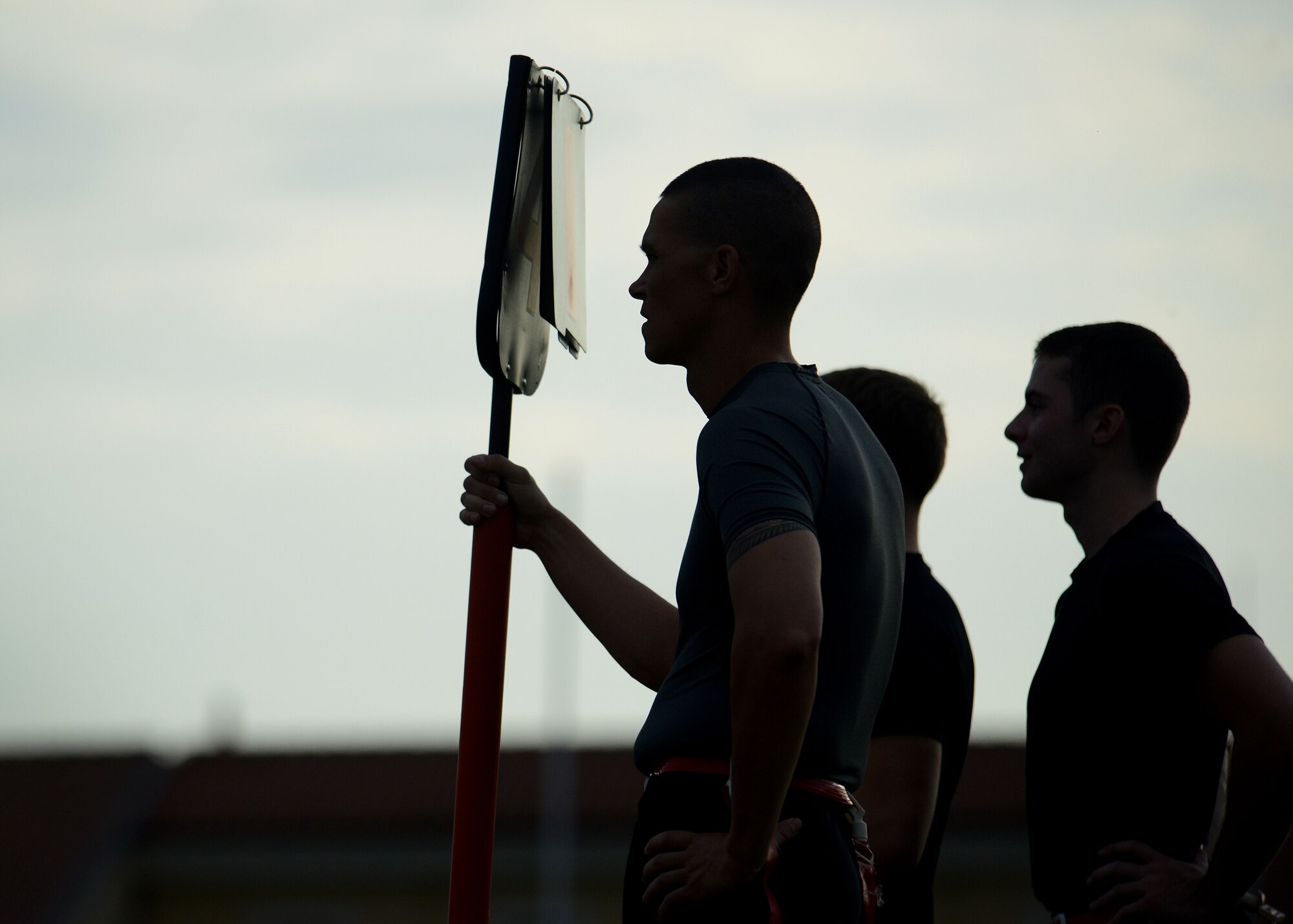 U.S. Air Force Airmen assigned to the 31st Communications Squadron stand on the sideline during an intramural flag football game, Sept. 24, 2015, at Aviano Air Base, Italy.  Games are played every Tuesday and Thursday starting at 5:30 p.m. at Freedom Park until Oct. 31. (U.S. Air Force photo by Staff Sgt. Evelyn Chavez/Released)