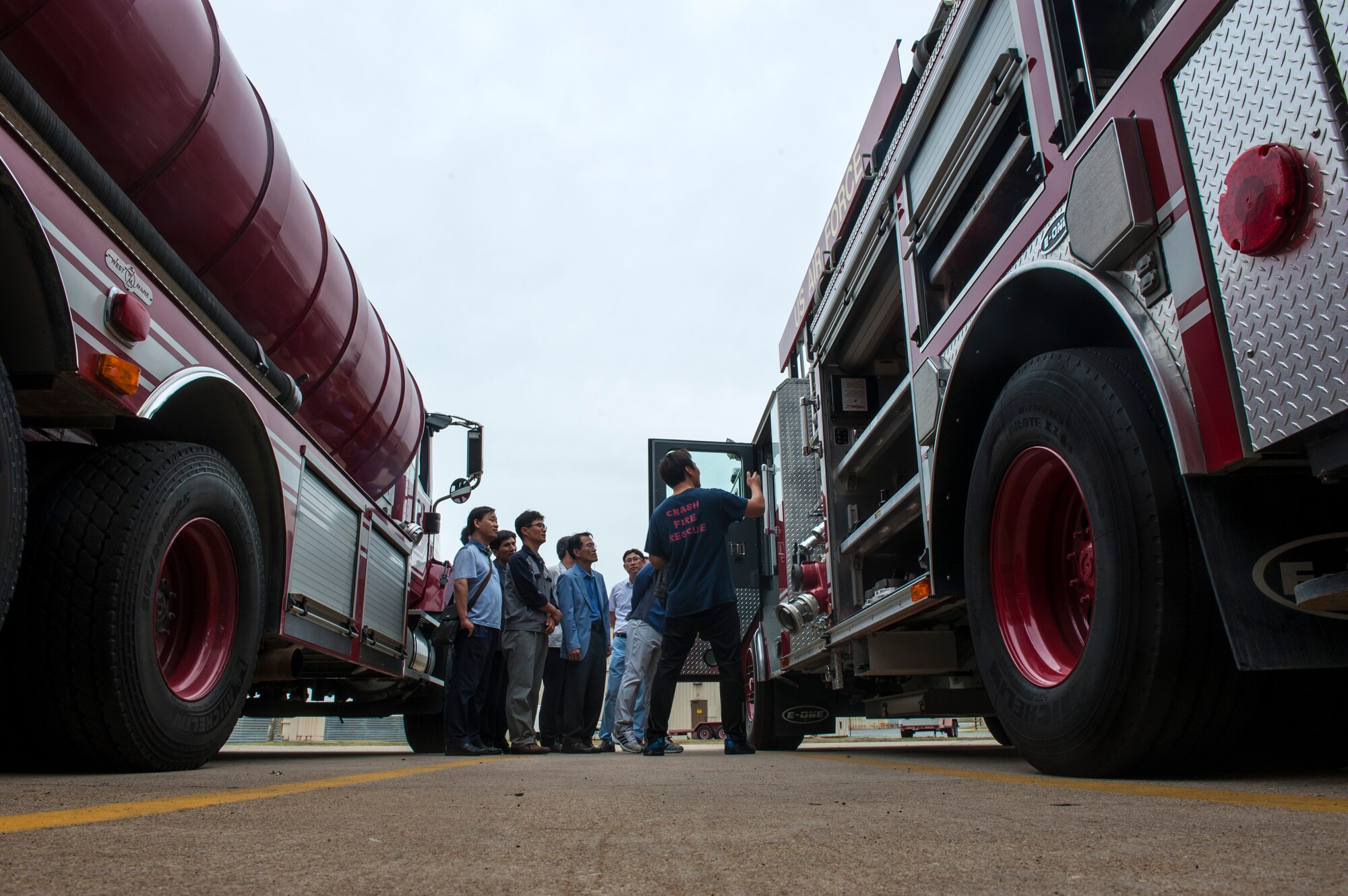 Members of the Gunsan City fire department receive a tour of a fire truck and a demonstration of various tools used by the 8th Civil Engineer Squadron fire department at Kunsan Air Base, Republic of Korea, Sept. 16, 2015. The purpose of the tour was for familiarization and to learn about the Wolf Pack firefighting mission. (U.S. Air Force photo by Staff Sgt. Nick Wilson/Released)