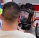 An Airman assigned to the 51st Civil Engineer Squadron's emergency management response team assists Staff Sgt. Jeffrey Williams, 51 CES emergency management plans and programs, with removing his respirator Sept. 24, 2015, near the city of Songtan, Republic of Korea. Airmen took advantage of a unique training opportunity to train in a simulated hazardous materials environment. (U.S. Air Force photo by Staff Sgt. Benjamin Sutton)