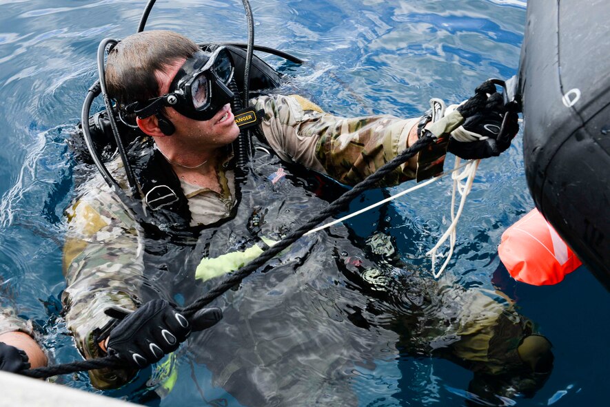 A U.S. Air Force combat control Airman from the 320th Special Tactics Squadron, Kadena Air Base, prepares to submerge during an amphibious operations exercise Sept. 22, 2015, off the west coast of Okinawa, Japan. Special tactics Airmen are trained to execute a variety of infiltration methods that enable them to be inserted into environments that may otherwise be unreachable. (U.S. Air Force photo by Senior Airman John Linzmeier)