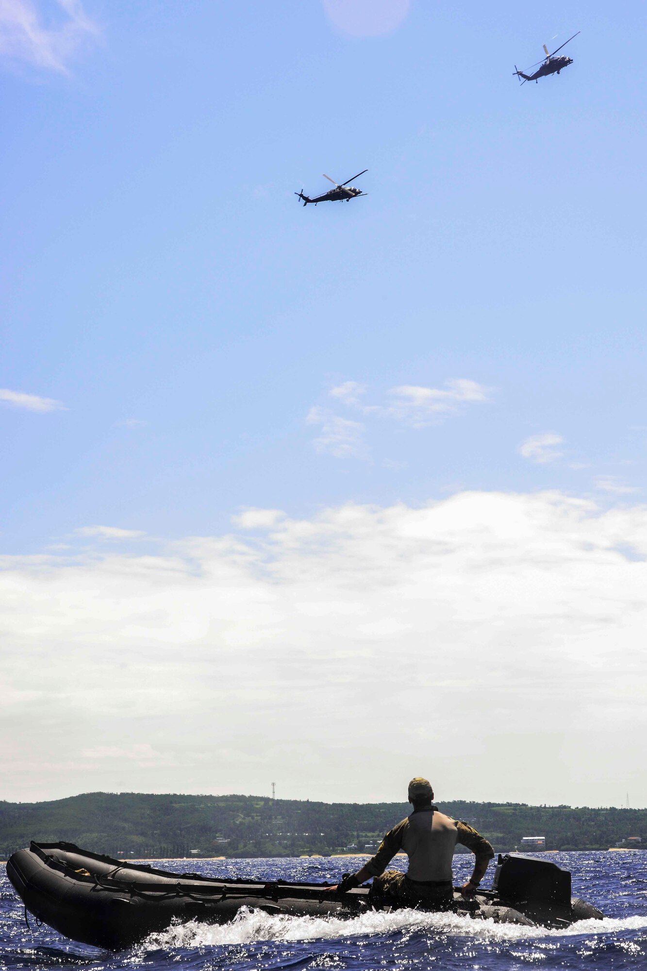 A U.S. Air Force combat controller from the 320th Special Tactics Squadron, Kadena Air Base, operates a combat rubber raiding craft during an amphibious operations exercise Sept. 22, 2015, off the West Coast of Okinawa, Japan. HH-60G Pave Hawks from the 33rd Rescue Squadron trained with a special tactics team to perform alternative insertion extractions in the ocean. (U.S. Air Force photo by Senior Airman John Linzmeier)