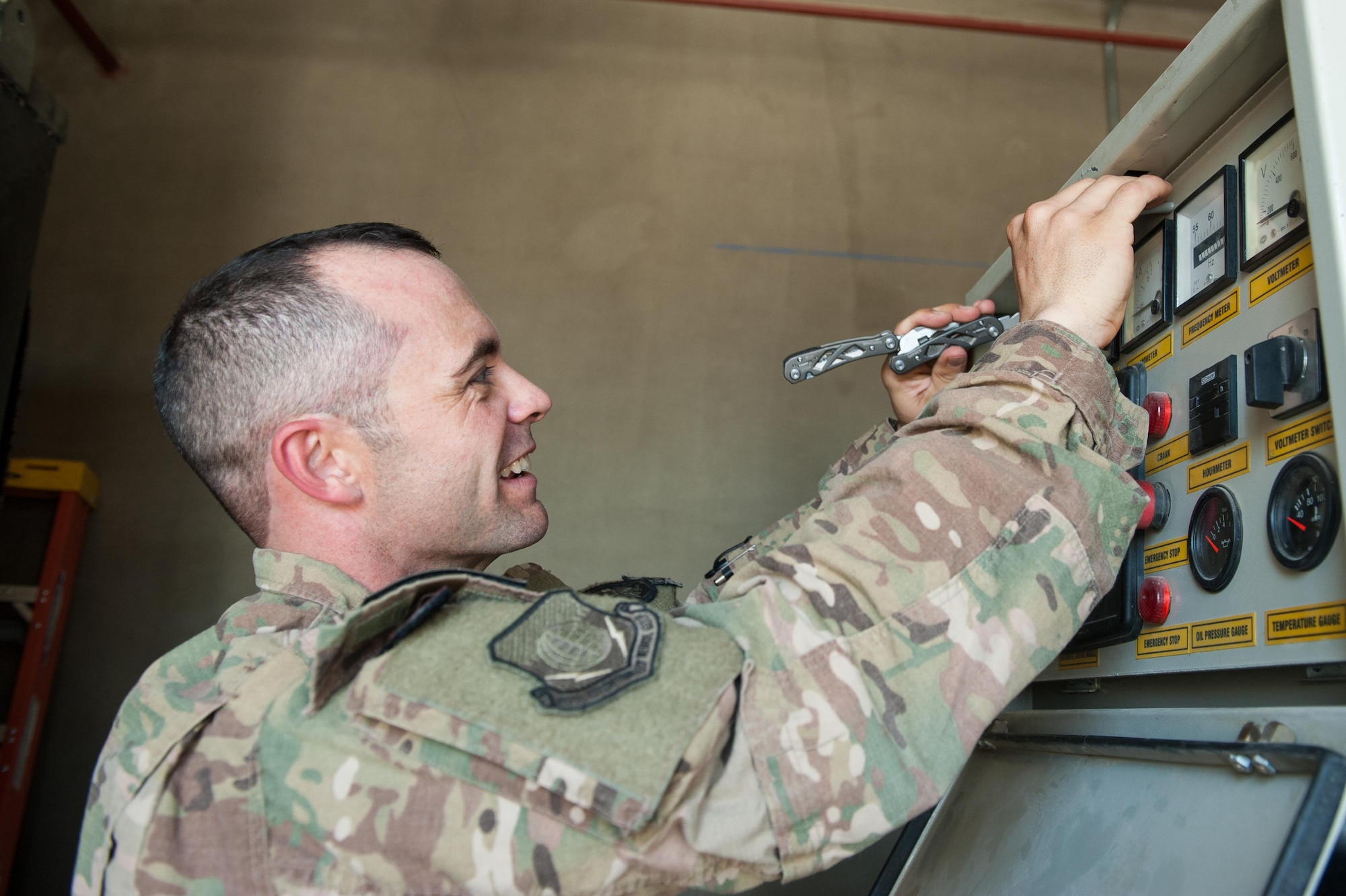 U.S. Air Force Tech. Sgt. Scott Hatch, 455th Expeditionary Medical Group biomedical equipment technician and Craig Joint Theater Hospital facility manager, performs a function check on a backup generator at Bagram Airfield, Afghanistan, Sept. 24, 2015. (U.S. Air Force photo by Tech. Sgt. Joseph Swafford/Released)