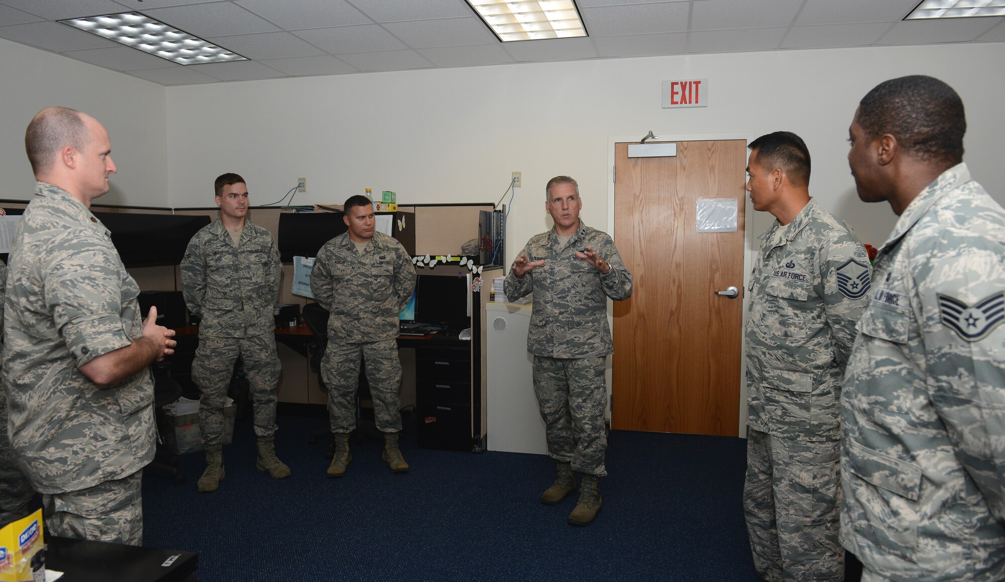 Maj. Gen. John C. Flournoy Jr., 4th Air Force commander, speaks with Airmen from the 36th Comptroller Squadron Sept. 21, 2015, at Andersen Air Force Base, Guam. Flournoy met with 36th CPTS Airmen to show appreciation for their support to the Air Force Reserve Command mission at Guam. (U.S. Air Force photo by Airman 1st Class Arielle Vasquez/Released)