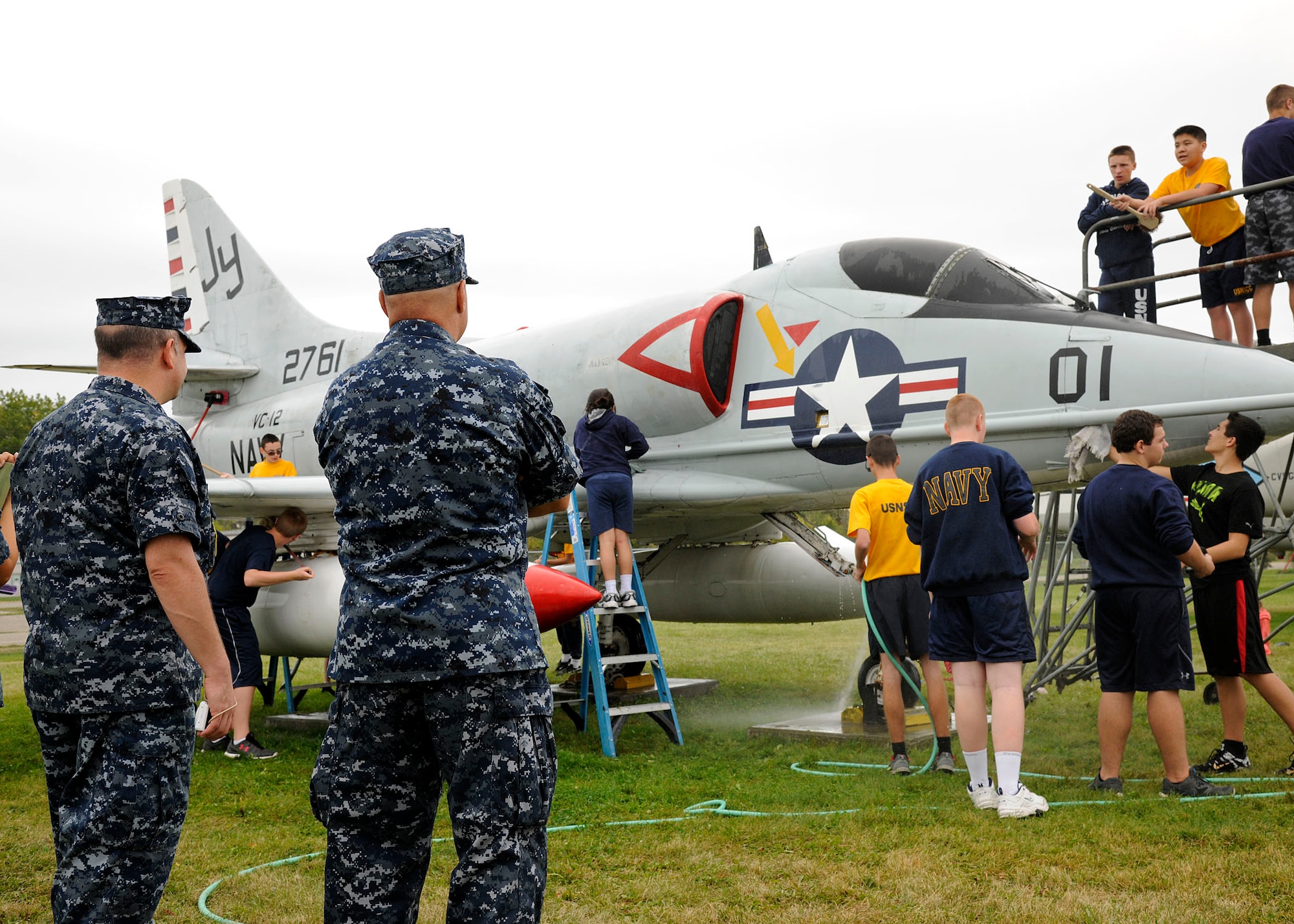 Sea Cadets from the Tomcat squadron, wash an A-4B Skyhawk at the Selfridge
Military Air Museum on Selfridge Air National Guard Base, Michigan, Sept.
27, 2015. The Tomcat squadron recently adopted the A-4B Skyhawk and helps
keep the aircraft in top shape. The Skyhawk is a single seat carrier-capable
attack aircraft developed for the United States Navy. The Skyhawk was
operated at Selfridge ANGB from 1969 to 1973. (U.S. Air National Guard photo
by Senior Airman Ryan Zeski/Released)
