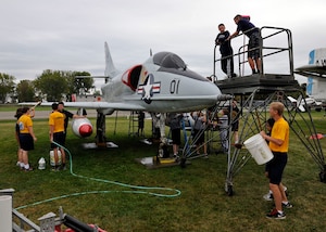 Sea Cadets from the Tomcat squadron, wash an A-4B Skyhawk at the Selfridge
Military Air Museum on Selfridge Air National Guard Base, Michigan, Sept.
27, 2015. The Tomcat squadron recently adopted the A-4B Skyhawk and helps
keep the aircraft in top shape. The Skyhawk is a single seat carrier-capable
attack aircraft developed for the United States Navy. The Skyhawk was
operated at Selfridge ANGB from 1969 to 1973. (U.S. Air National Guard photo
by Senior Airman Ryan Zeski/Released)
