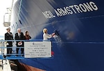 140329-N-PO203-336 ANACORTES, Wash. (Mar. 29, 2014) Carol Armstrong, ship's sponsor for the  Auxiliary General Oceanographic Research (AGOR) research vessel (R/V) Neil Armstrong (AGOR 27), breaks a bottle across bow during a christening ceremony at Dakota Creek Industries, Inc., shipyard in Anacortes, Wash. Joining Carol on the platform are Rear Adm. Matthew Klunder, left, chief of naval research, Mr. Dick Nelson, president, Dakota Creek Industries, Inc., and Kali Armstrong, granddaughter of the late astronaut. The Navy, through the Office of Naval Research (ONR), has been a leader in building and providing large ships for the nation's academic research fleet since World War II. (U.S. Navy photo by John F. Williams/Released)