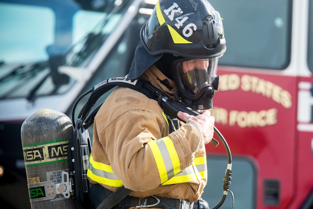 U.S. Air Force 2nd Lt. Andrew Fenner performs checks during firefighting training at the burn pit on Royal Air Force Lakenheath, England, Sept. 17, 2015. Fenner is a project programmer assigned to the 48th Fighter Wing Civil Engineer Squadron. U.S. Air Force photo by Senior Airman Trevor T. McBride
