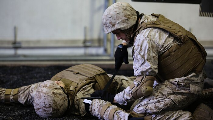 A Marine with 2nd Supply Battalion, Combat Logistics Regiment 25, applies a tourniquet to a simulated casualty at Marine Corps Base Camp Lejeune, North Carolina, Sept. 23, 2015. The battalion conducted the training, which simulates vehicle rollovers and how to react, in order to hone their skills prior to deploying. 