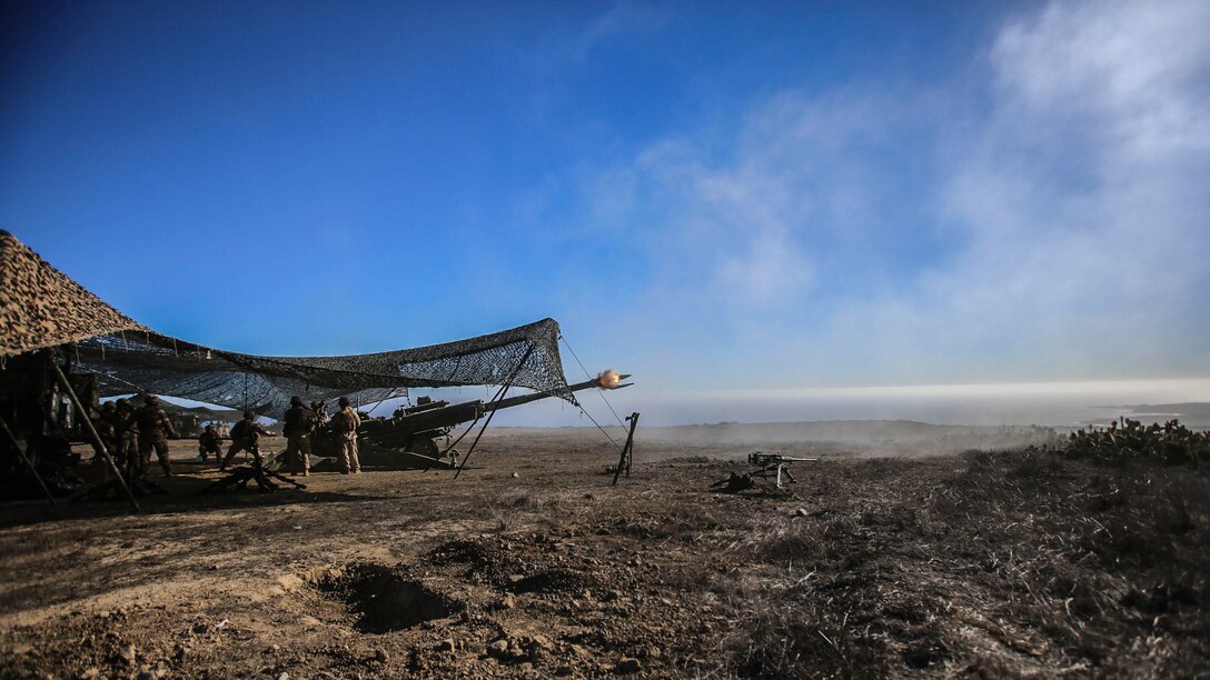 Marines from Battery B, 1st Battalion, 11th Marine Regiment, fire rounds down range in support of Supporting Arms Coordination Center Exercise on San Clemente Island, Calif., Sept. 25, 2015.The exercise is the first the Marines and Sailors will work together at sea as they prepare for deployment to the Pacific and Central Command areas of responsibility in early 2016. 