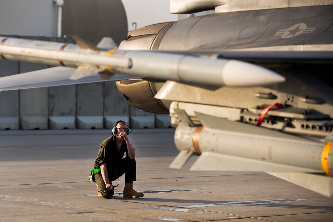 U.S. Air Force Airman 1st Class Dexter Fitzpatrick performs a preflight inspection on an F-16 Fighting Falcon aircraft on Bagram Airfield, Afghanistan, Sept. 15, 2015. Fitzpatrick is assigned to the 455th Expeditionary Aircraft Maintenance Squadron.