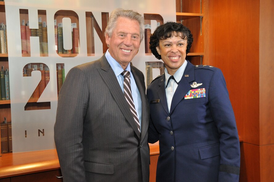 Maj. Gen. Stayce Harris, 22nd Air Force commander, poses 
for a photo with Dr. John Maxwell, best-selling author and leadership guru, following their presentations for the Honor2Lead symposium at the University of North Georgia in Dahlonega, Ga., Sept. 25, 2015. Harris was one of six senior executives to speak to an international audience of thousands on values-based leadership. This was the inaugural event for the Honor2Lead program, a live event which brought together members from academia, military and business to discuss the vital role shared values plays in developing current and future leaders. (U.S. Air Force photo/Lt. Col. James R. Wilson)
