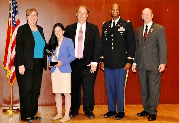 New York District procurement technician Jessica Novick recently received the Outstanding Administrative Support Award from the New York City Federal Executive Board recognizing her outstanding accomplishments in administrative work. In photo, Jessica Novick (second from left), Francis Cashman, chief, Contracting Division, (middle), and Lt. Col. John Knight (second from right), stand with members of the Federal Executive Board.