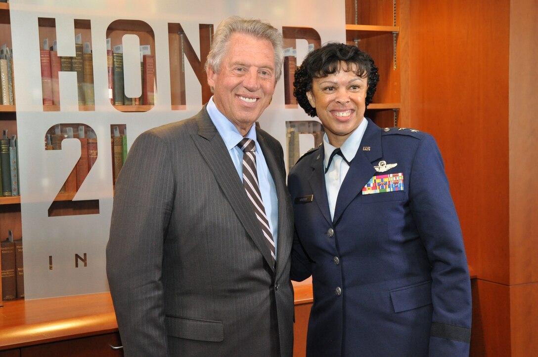 Maj. Gen. Stayce Harris, 22nd Air Force commander, poses 
for a photo with Dr. John Maxwell, best-selling author and leadership guru, following their presentations for the Honor2Lead symposium at the University of North Georgia in Dahlonega, Ga., Sept. 25, 2015. Harris was one of six senior executives to speak to an international audience of thousands on values-based leadership. This was the inaugural event for the Honor2Lead program, a live event which brought together members from academia, military and business to discuss the vital role shared values plays in developing current and future leaders. (U.S. Air Force photo/Lt. Col. James R. Wilson)
