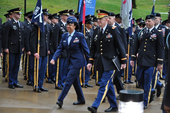 Maj. Gen. Stayce Harris, 22nd Air Force commander and
(retired) Col. Tom Palmer, Commandant of Cadets for the University of North Georgia, proceed through a cadet cordon on their way to the inaugural Honor2Lead symposium at the school's Library and Technology Center in Dahlonega, Ga., Sept. 25, 2015. Honor2Lead was created in an effort to emphasize the importance of ethics and values in today's business, academia and military environments.(U.S. Air Force photo/Lt. Col. James R. Wilson)
