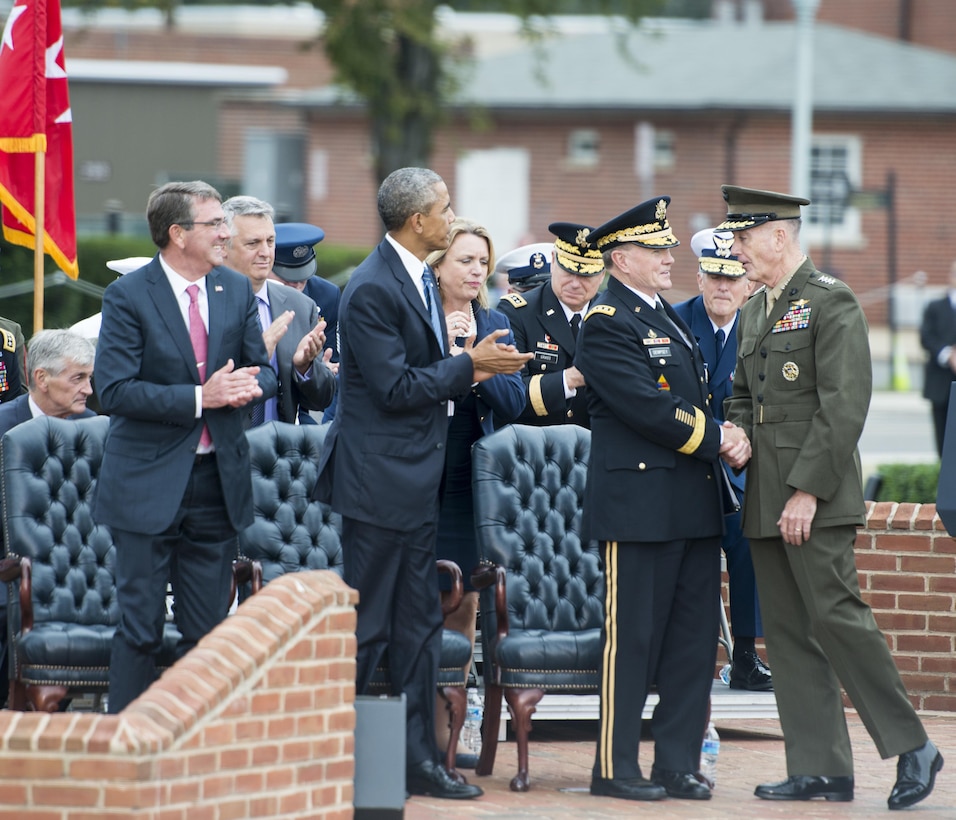Front row, from left, Defense Secretary Ash Carter; President Barack Obama; Army Gen. Martin E. Dempsey, outgoing chairman of the Joint Chiefs of Staff;  and the incoming chairman, Marine Corps Gen. Joseph F. Dunford Jr., attend a ceremony for Dempsey’s retirement and the chairman change of responsibility on Joint Base Myer-Henderson Hall in Arlington, Va., Sept. 25, 2015. DoD photo by Petty Officer 2nd Class Dominique A. Pineiro