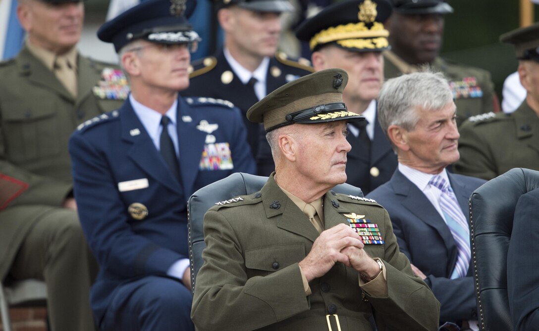 Marine Corps Gen. Joseph F. Dunford Jr., incoming chairman of the Joint Chiefs of Staff, listens to remarks from the outgoing chairman, Army Gen. Martin E. Dempsey, during a retirement and change of responsibility ceremony on Joint Base Myer-Henderson Hall in Arlington, Va., Sept. 25, 2015. DoD photo by Petty Officer 2nd Class Dominique A. Pineiro