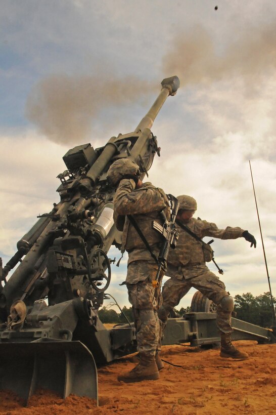 An M777A2 howitzer crew fires a high angle round during the Division Artillery Readiness Test on Fort Bragg, N.C., Sept. 18, 2015. U.S. Army photo by Capt. Joe Bush