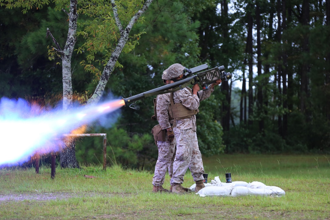 A Marine fires an FIM-92 Stinger Missile at a target during a stinger simulation training range at Marine Corps Air Station Cherry Point, N.C., Sept. 24, 2015. Marines with 2nd Low Altitude Air Defense Battalion sharpened their proficiency skills by simulating the weight transfer felt when firing the 34.2 pound missile. The weapon is a personal and portable infrared, homing, surface-to-air missile capable of tracking and engaging aircraft up to an altitude of 10,000 feet and covering distances up to eight kilometers. 2nd LAAD utilizes the stinger missile to provide ground-to-air defense to the 2nd Marine Aircraft Wing and Marine Air-Ground Task Force elements. (U.S. Marine Corps photo by Cpl. N.W. Huertas/ Released)