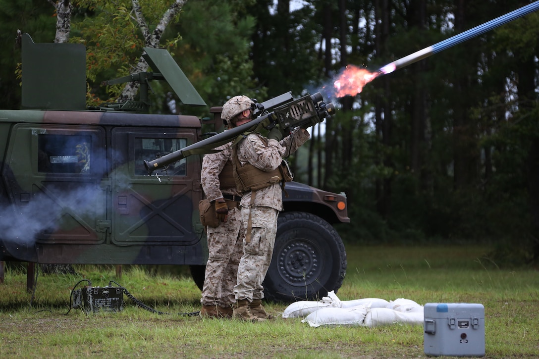 A Marine fires an FIM-92 Stinger Missile at a target during a stinger simulation training range at Marine Corps Air Station Cherry Point, N.C., Sept. 24, 2015. Marines with 2nd Low Altitude Air Defense Battalion sharpened their proficiency skills by simulating the weight transfer felt when firing the 34.2 pound missile. The weapon is a personal and portable infrared, homing, surface-to-air missile capable of tracking and engaging aircraft up to an altitude of 10,000 feet and covering distances up to eight kilometers. 2nd LAAD utilizes the stinger missile to provide ground-to-air defense to the 2nd Marine Aircraft Wing and Marine Air-Ground Task Force elements.(U.S. Marine Corps photo by Cpl. N.W. Huertas/ Released) 