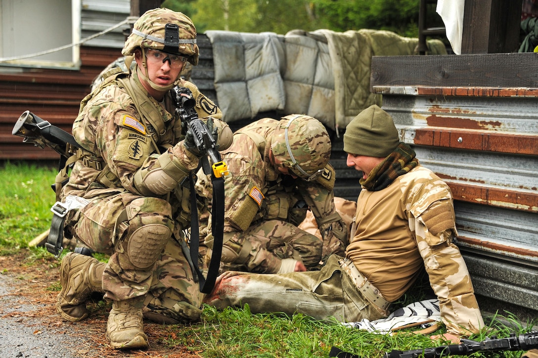 U.S. Army paratroopers provide first aid to a simulated casualty during Exercise Sky Soldier II on the Bechyne Training Area in the Czech Republic, Sept. 23, 2015. Sky Soldier is a series of bilateral exercises designed to increase interoperability and strengthen partnerships between NATO airborne forces. The paratroopers are assigned to the 1st Squadron, 91st Cavalry Regiment, 173rd Airborne Brigade. U.S. Army photo by Markus Rauchenberger