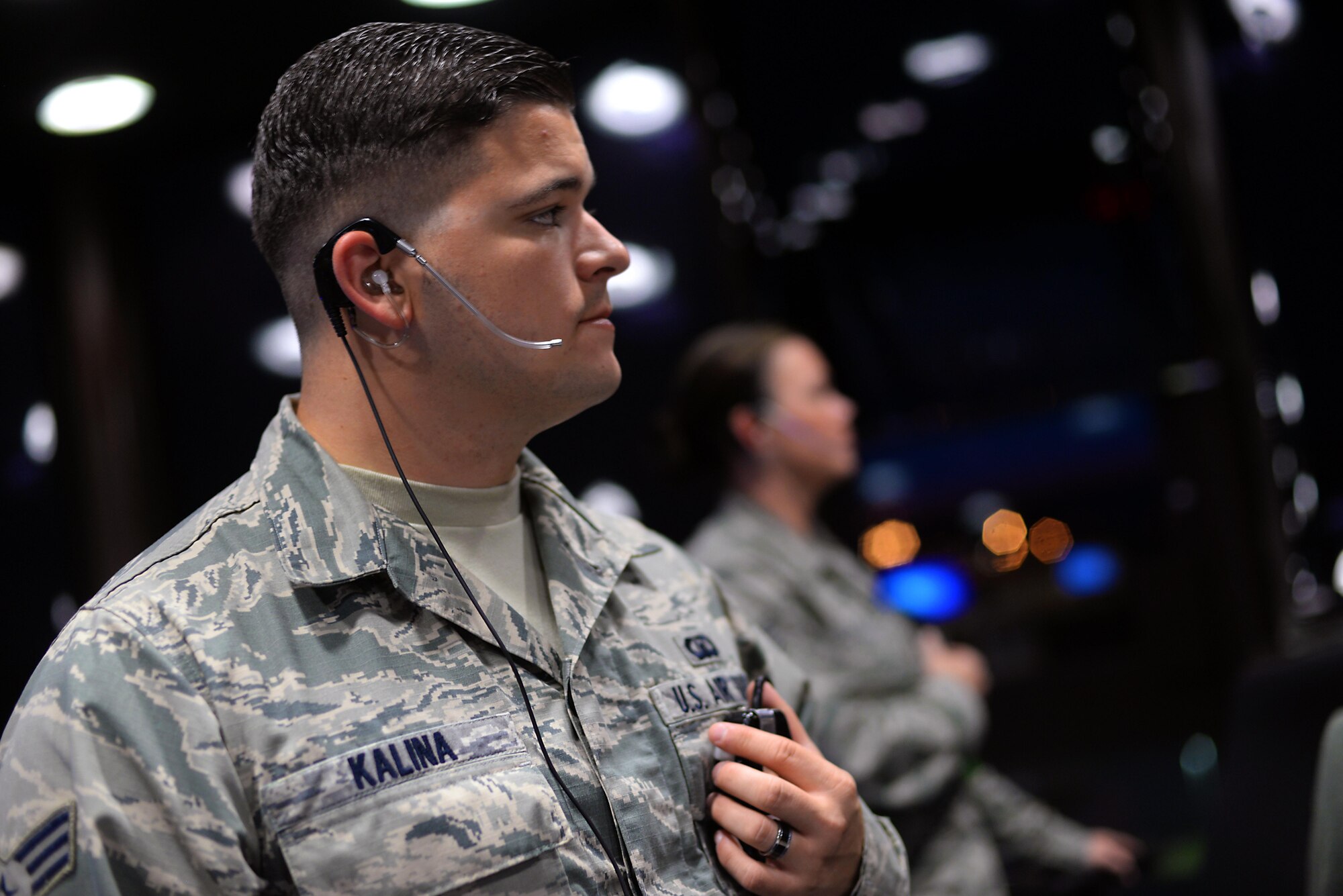 Senior Airman Drew Kalina, a 100th Operations Support Squadron air traffic controller, communicates with a pilot Sept. 22, 2015, on Royal Air Force Mildenhall, England. The ATCs are put under intense training and evaluation before becoming certified controllers. (U.S. Air Force photo/Senior Airman Christine Halan)