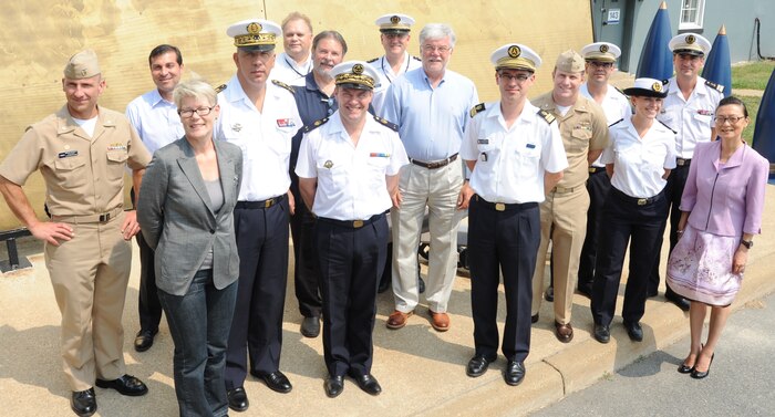 Naval Surface Warfare Center Dahlgren Division (NSWCDD) and French military officials pause in front of the Potomac River Test Range metal map during the French delegation's tour. Dahlgren scientists and engineers briefed the delegation on the command's testing facilities and technologies ranging from the electromagnetic railgun to the hypervelocity projectile. "Working together with our allies during the science and technology as well as the RDT&E (research, development, test and evaluation) phases can lead to many benefits such as program improvements, cost and time savings plus enhanced interoperability," said Jed Ryan, NSWCDD International Partnering Office lead. NSWCDD Commanding Officer Capt. Brian Durant, left, stands with the delegation led by French Rear Adm. Jean-Philippe Chaineau, Deputy Chief of Naval Staff Plans and Programs, and French Rear Adm. Christian Dugué, Naval Technical Director for the Defense Procurement Agency, pictured 4th and 7th respectively from left. U.S. Navy senior executives - Rino Pivirotto, Navy International Programs Office executive director, and Dr. Walter Jones, Office of Naval Research executive director - who are counterparts to the French admirals, stand 6th and 9th from left.