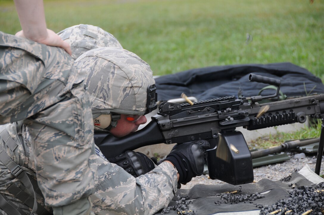 Senior Airman Thomas Reed, a member of the 910th Security Forces Squadron (SFS), fires the M249 automatic rifle during training here, Sept. 10, 2015. A team of security forces airmen participated in a four-day training mission to help refresh or familiarize themselves with different aspects of their jobs. (U.S. Air Force photo/ Tech. Sgt. Rick Lisum)