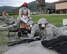 Senior Airman Brystal Thomas, a member of the 910th Security Forces Squadron (SFS), fires the M249 automatic rifle during training here, Sept. 10, 2015. Senior Airman Justin Herod, also a member of 910th SFS, serves Thomas as assistant gunner.  Senior Airman Danielle Massengil, another member of the 910th SFS, observes the airmen as their combat arms instructor. The security forces airmen are participating in a four-day training mission to help refresh or familiarize themselves with different aspects of their jobs. (U.S. Air Force photo/ Tech. Sgt. Rick Lisum)
