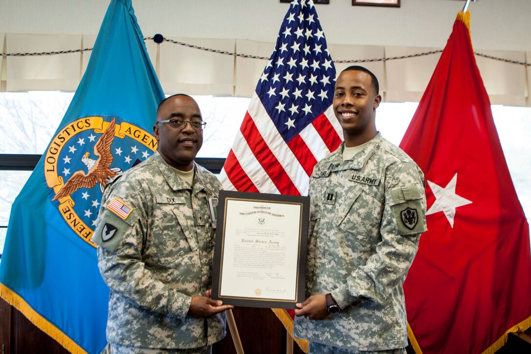 Army 1st Lt. Domonick Sylve, aide-de-camp to the Defense Logistics Agency Distribution commander, pinned on the rank of captain in a ceremony on May 1.
