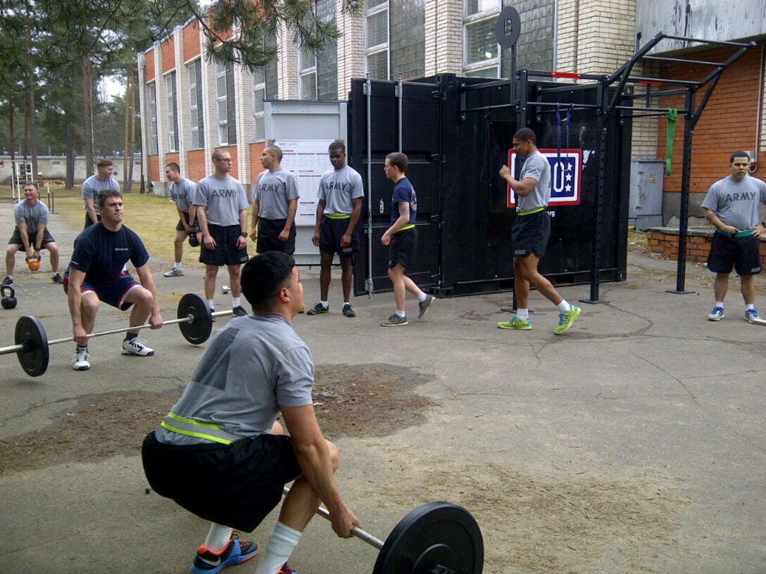 Fitness equipment from the BeaverFit containers shipped by the United Service Organization-Europe is used by soldiers from 2nd Cavalry Regiment, U.S. Army Europe, at the Adazi training area near Riga, Latvia.