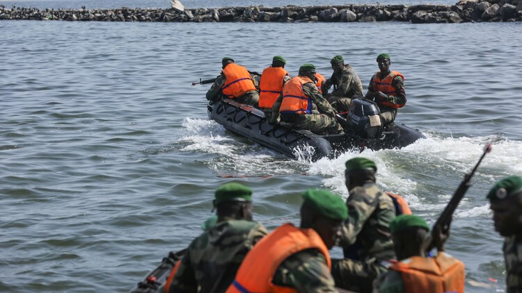 Compagnie Fusilier de Marin Commandos depart after raiding a simulated enemy position during the final exercise with U.S. service members in Dakar, Senegal, Sept. 17, 2015. The Marines and Coast Guardsmen with Special-Purpose Marine Air-Ground Task Force Crisis Response-Africa spent four weeks training the COFUMACO on basic infantry tactics and small-boat operations as a part of a Maritime Security Force Assistance mission to increase interoperability with Senegal’s and strengthen the bond between the partner nations. 