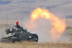 A Japan Ground Self-Defense Force tank fires at a target during Rising Thunder’s culminating live fire exercise at Yakima Training Center, Sept. 22, 2015.