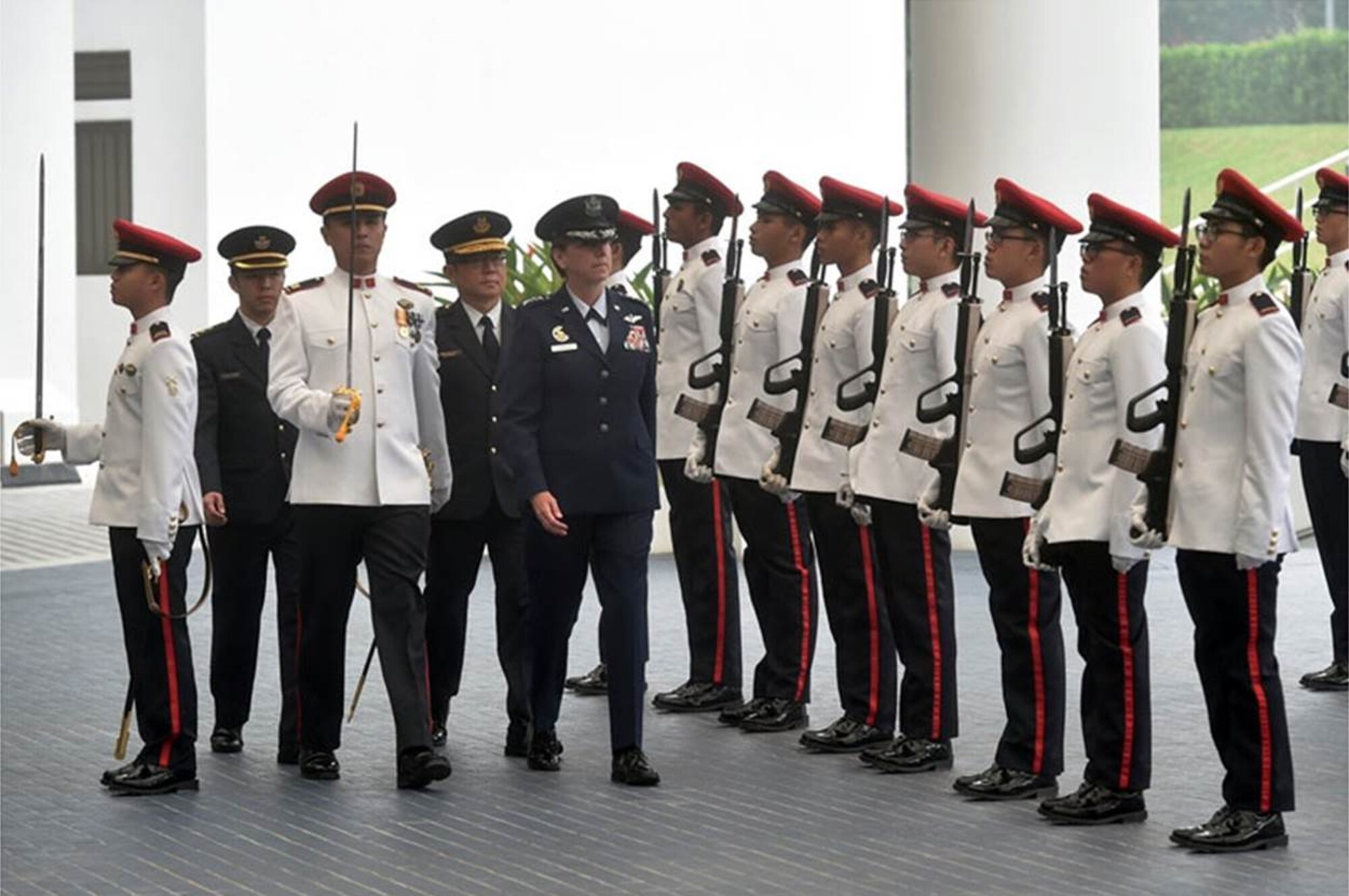 U.S. Air Force Gen. Lori J. Robinson, Pacific Air Forces commander, inspects the Guard of Honour at the Ministry of Defence in Singapore Sept. 28, 2015. The inspection was part of Robinson’s introductory visit to Singapore from Sept. 27-30, 2015, in which she will visit the Changi Command and Control Centre at Sembawang Air Base, Singapore, and speak to students at the Goh Keng Swee Command and Staff College. The visit highlights the partnership between the two countries, as well as enhancing the interoperability and professionalism between the two air forces. (Singapore Ministry of Defence photo/Released)