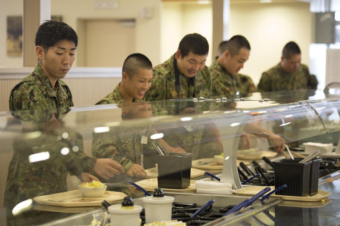 Japan Ground Self-Defense Force members joined Marines for lunch at the R.G. Robinson Mess Hall at Marine Corps Air Station Iwakuni, Japan, Sept. 15, 2015. Members of the JGSDF visited MCAS Iwakuni for an English seminar helping them to better communicate with American military members and build a greater positive relationship between the Japanese and Americans.