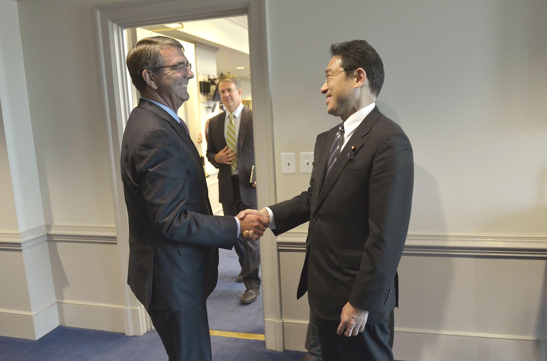 U.S. Defense Secretary Ash Carter introduces himself as he prepares to meet with Japanese Foreign Minister Fumio Kishida at the Pentagon, Sept. 28, 2015. DoD photo by Glenn Fawcett