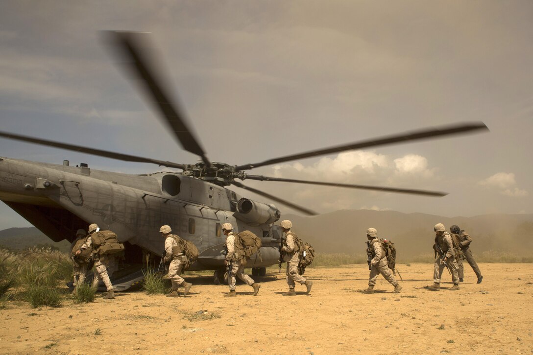 U.S. Marines board a CH-53E Super Stallion rotary-wing aircraft at Aibano training area, Sept. 15, 2015. The aircraft provided assault transport during a bilateral air assault comprehensive exercise at Aibano Training Area. The exercise is part of Forest Light 16-1, an exercise to increase interoperability of Japan Ground Self-Defense Force and U.S. Marine Corps forces. U.S. Marines are with 1st Battalion, 2nd Marine Regiment currently assigned to 4th Marine Regiment, 3rd Marine Division, III Marine Expeditionary Force. 