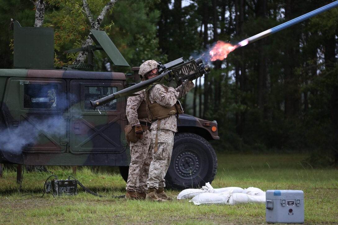 A Marine fires an FIM-92 Stinger Missile at a target during a stinger simulation training range at Marine Corps Air Station Cherry Point, N.C., Sept. 24, 2015. Marines with 2nd Low Altitude Air Defense Battalion sharpened their proficiency skills by simulating the weight transfer felt when firing the 34.2 pound missile. The weapon is a personal and portable infrared, homing, surface-to-air missile capable of tracking and engaging aircraft up to an altitude of 10,000 feet and covering distances up to eight kilometers. 2nd LAAD utilizes the stinger missile to provide ground-to-air defense to the 2nd Marine Aircraft Wing and Marine Air-Ground Task Force elements.(U.S. Marine Corps photo by Cpl. N.W. Huertas/ Released) 