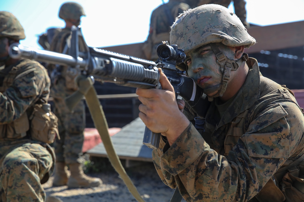 Marine Corps Pfc. Mason A. Davis, Charlie Company, 1st Recruit Training Battalion, provides security while his fire team works its way through one of the 12 obstacles at Edson Range, Marine Corps Base Camp Pendleton, Sept. 23, 2015. U.S. Marine Corps photo by Cpl. Jericho Crutcher
