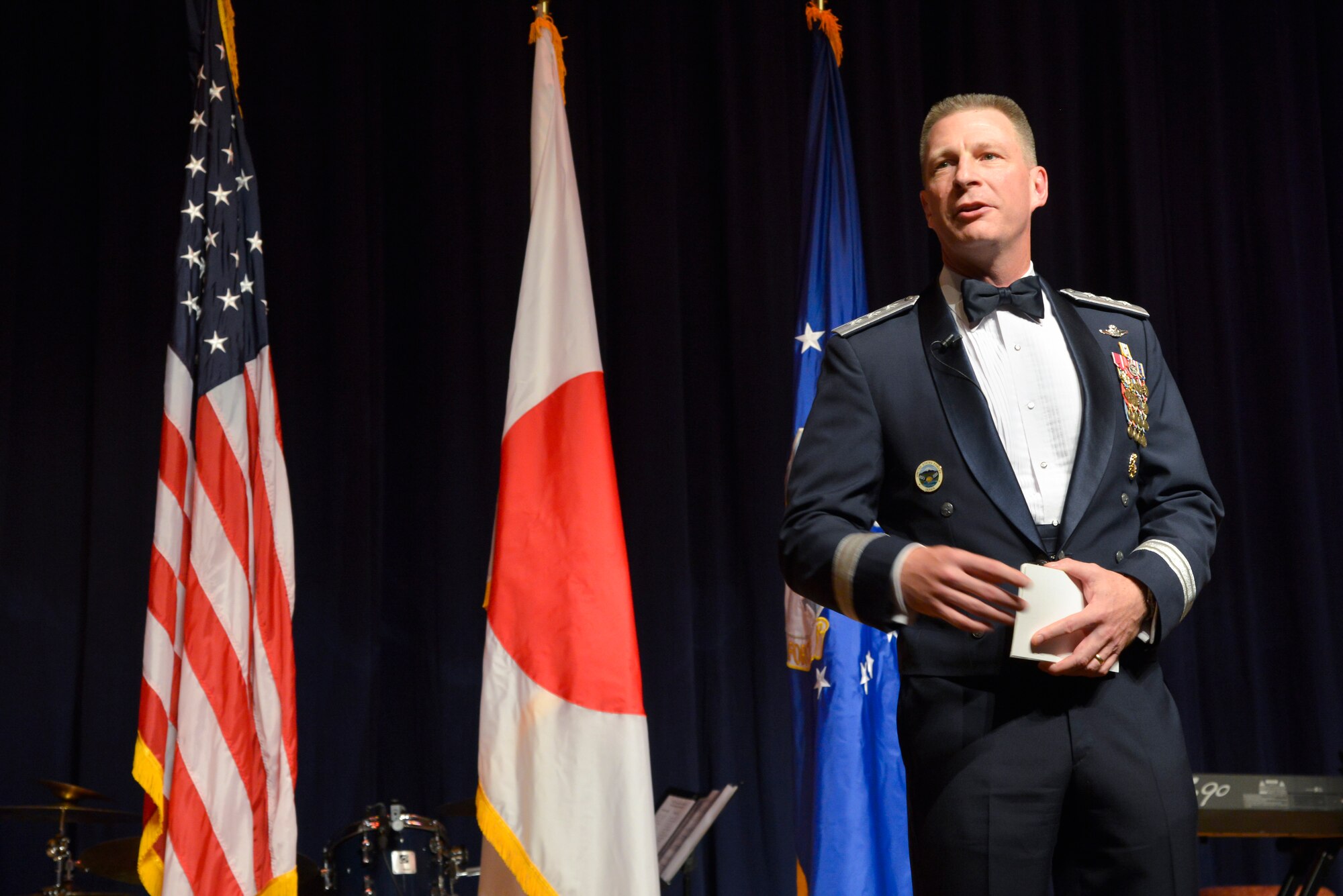 Lt. Gen. John Dolan, U.S. Forces Japan and 5th Air Force commander, gives his opening remarks to those in attendance at the Air Force ball at Yokota Air Base, Japan, Sept. 25, 2015. This year's ball marked the 68th anniversary of the Air Force and commemorated its heritage. (U.S. Air Force photo by Senior Airman David Owsianka/Released)