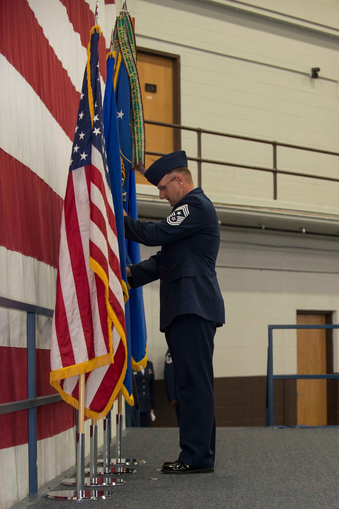 Chief Master Sgt. Marty Anderson, Eighth Air Force command chief, posts the Eighth Air Force organizational flag during the B-1 realignment ceremony at Ellsworth Air Force Base, S.D., Sept. 28, 2015. B-1 bomber fleets from Ellsworth and Dyess Air Force Base, Texas, and the Long Range Strike Bomber program are transitioning from Air Combat Command to Air Force Global Strike Command, official Oct. 1. (U.S. Air Force photo by Senior Airman Rebecca Imwalle/Released)