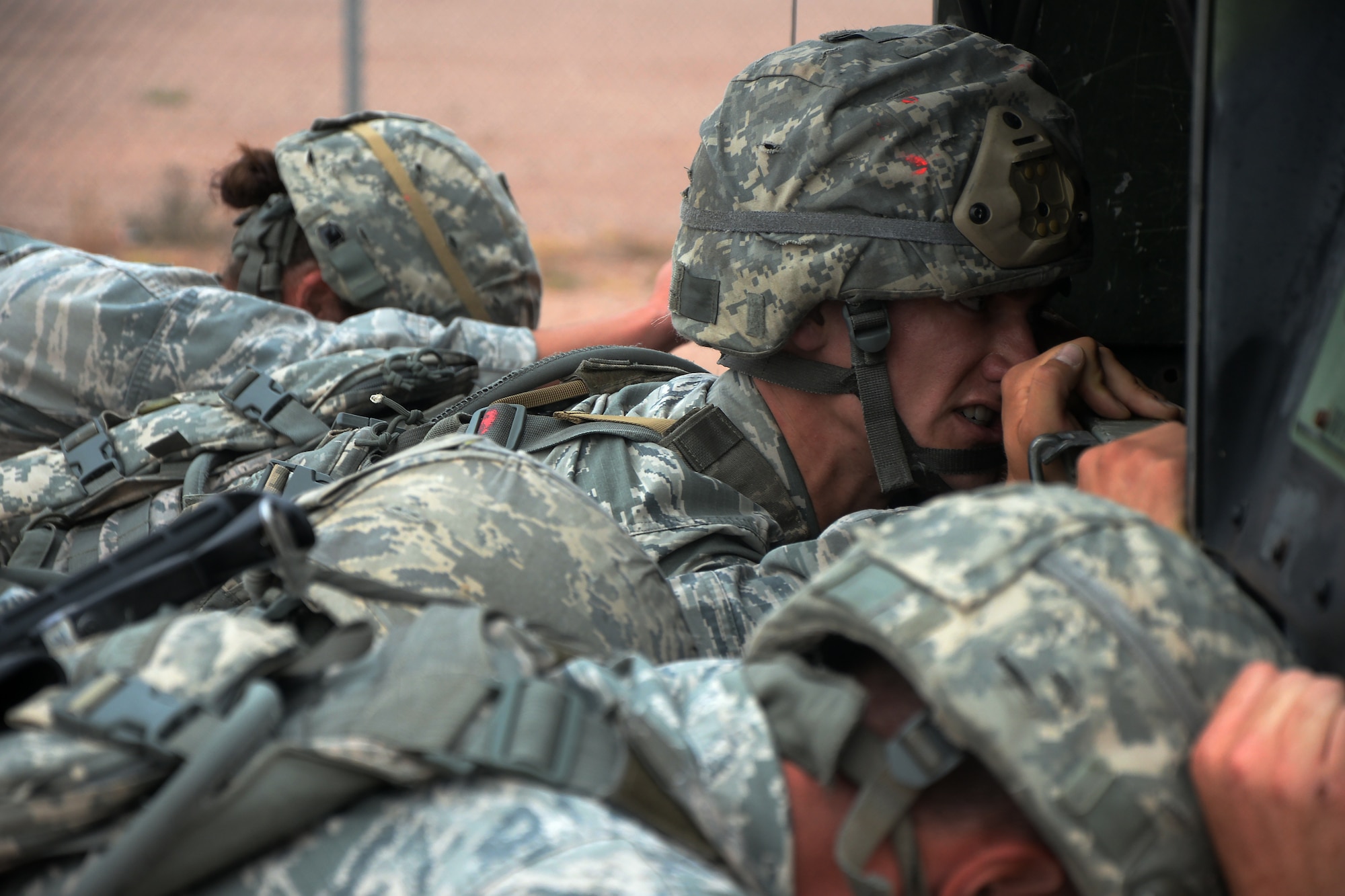 Airman 1st Class Samuel O’Brian, 377th Air Base Wing, Kirtland Air Force Base, N.M., and the 377th ABW team pushes a Humvee 100 yards Sept. 34, 2015, during the warrior run portion of the 2015 Global Strike Challenge on Camp Guernsey, Wyo. The run was the final part of a four day competition which put 10 teams from eight bases head-to-head to determine who is the best of the best. (U.S. Air Force photo by Senior Airman Brandon Valle)