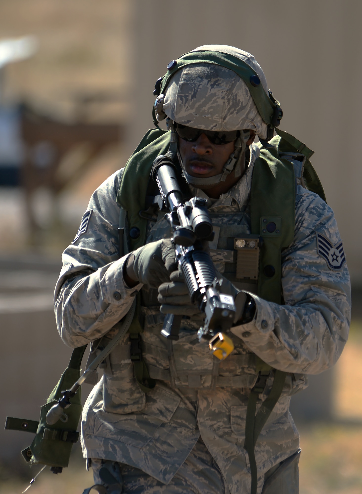 Staff Sgt. Joshua Hill, 307th Bomb Wing, Barksdale Air Force Base, La., moves towards a building Sept. 24, 2015, during the tactical recapture portion of the 2015 Global Strike Challenge security forces competition on Camp Guernsey, Wyo. Teams had to search through a village for a missing asset that had been stolen by opposing forces. (U.S. Air Force photo by Senior Airman Brandon Valle)