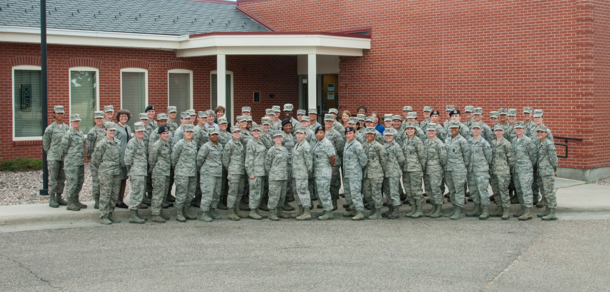 Airmen and guest speakers who attended the 20th Air Force Women’s Leadership Symposium pose for a photo outside the Trail’s End Event Center on F.E. Warren Air Force Base, Wyo., Sept. 16, 2015. The two-day symposium brought women from across 20th AF together to develop leadership, network and address issues faced by women in the Air Force. (U.S. Air Force photo by Senior Airman Jason Wiese)