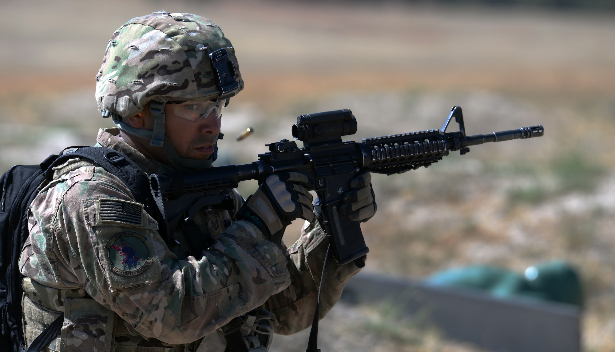 Master Sgt. Jason Garo, 5th Bomb Wing, Minot Air Force Base, N.D., watches a casing fly away from his M-4 assault rifle Sept. 23, 2015, during the shooting range portion of the 2015 Global Strike Challenge security forces competition on Camp Guernsey, Wyo. Competitors scored points based on the number of targets they hit as well as how quickly they finished the course. (U.S. Air Force photo by Senior Airman Brandon Valle)