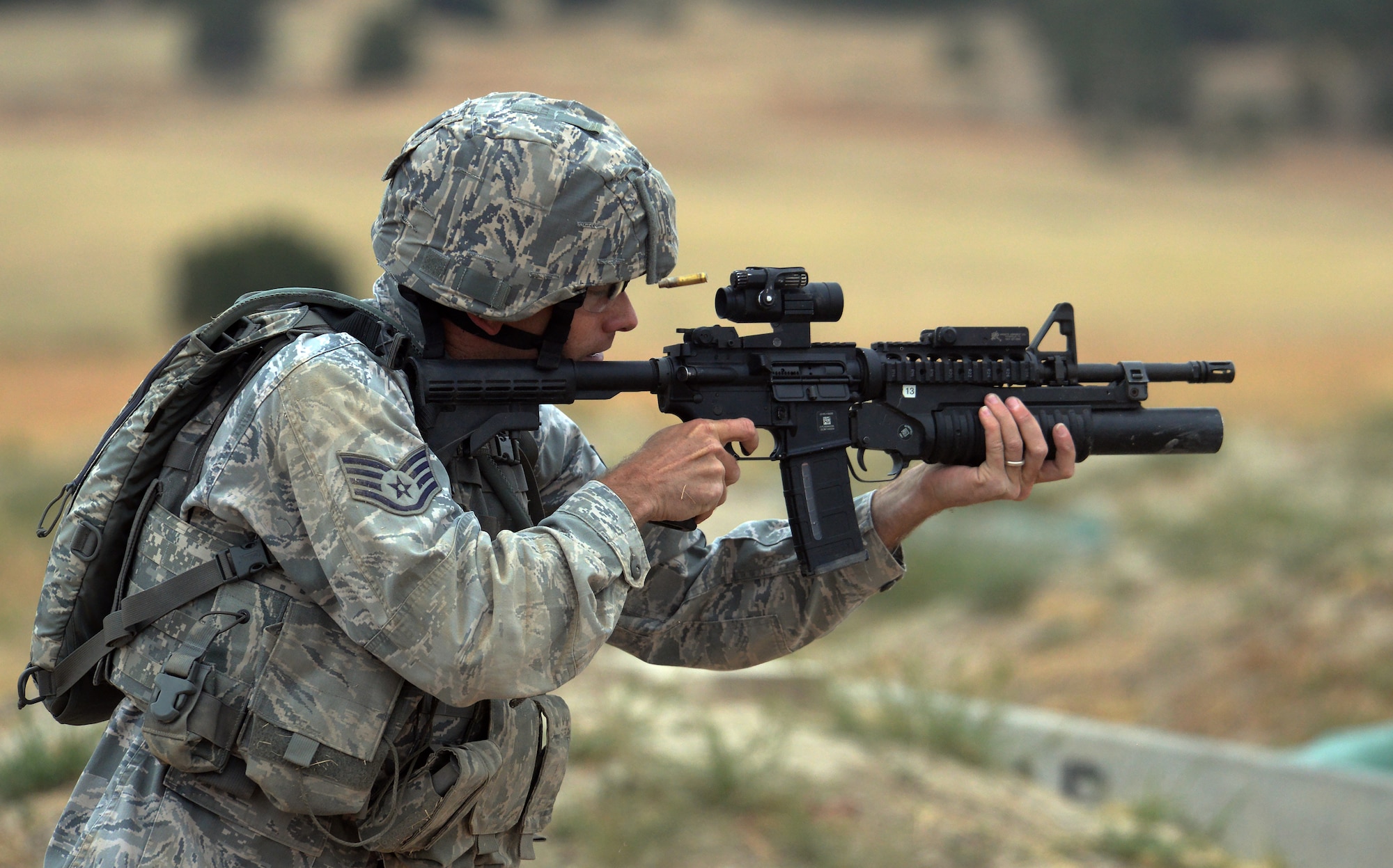 Staff Sgt. Nathan Warren, 28th Bomb Wing, Ellsworth Air Force Base, S.D., fires an M-4 assault rifle at a target during the shooting range portion of the 2015 Global Strike Challenge security forces competition on Camp Guernsey, Wyo., Sept. 23, 2015. Competitors scored points based on the number of targets hit as well as how quickly they finished the course. (U.S. Air Force photo by Senior Airman Brandon Valle)
