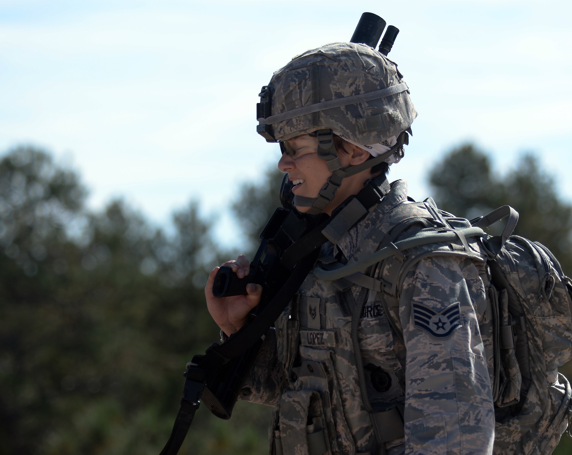 Staff Sgt. Natalie Lopez, 7th Bomb Wing, Dyess Air Force Base, Texas, pushes through pain while running from one shooting range to the next Sept. 22, 2015, during the shooting range portion of the 2015 Global Strike Challenge security forces competition on Camp Guernsey, Wyo. Each portion of the GSC was designed to test security forces Airmen on day-to-day skills as well as pushing them physically. (U.S. Air Force photo by Senior Airman Brandon Valle)