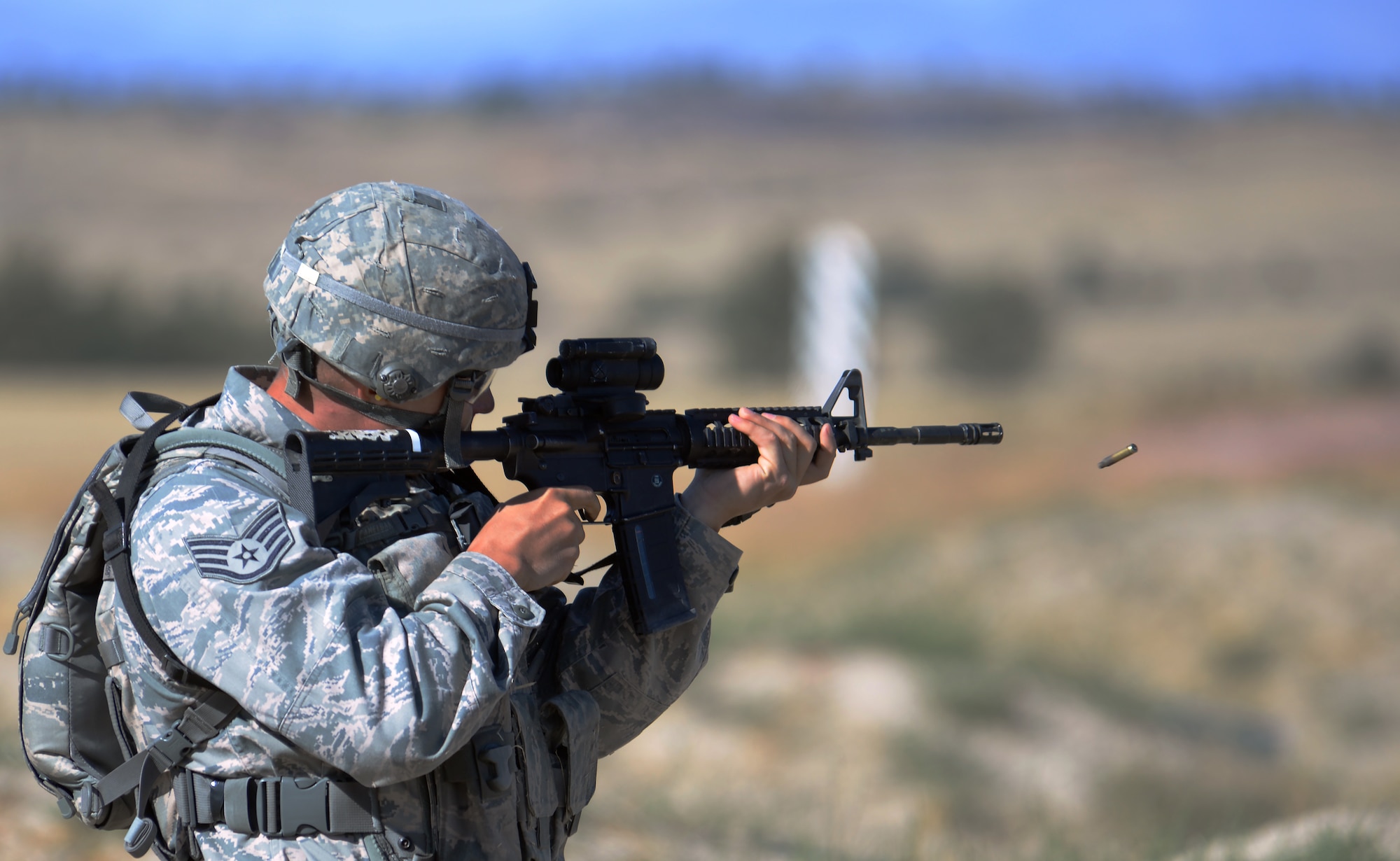 Staff Sgt. James Finley, 7th Bomb Wing, Dyess Air Force Base, Texas, fires at a target with a M-4 assault rifle Sept. 22, 2015, during the shooting range portion of the 2015 Global Strike Challenge security forces competition on Camp Guernsey, Wyo. The shooting competition required Airmen to use both precision and speed to complete a course where they showed proficiency in a number of different weapons. (U.S. Air Force photo by Senior Airman Brandon Valle)