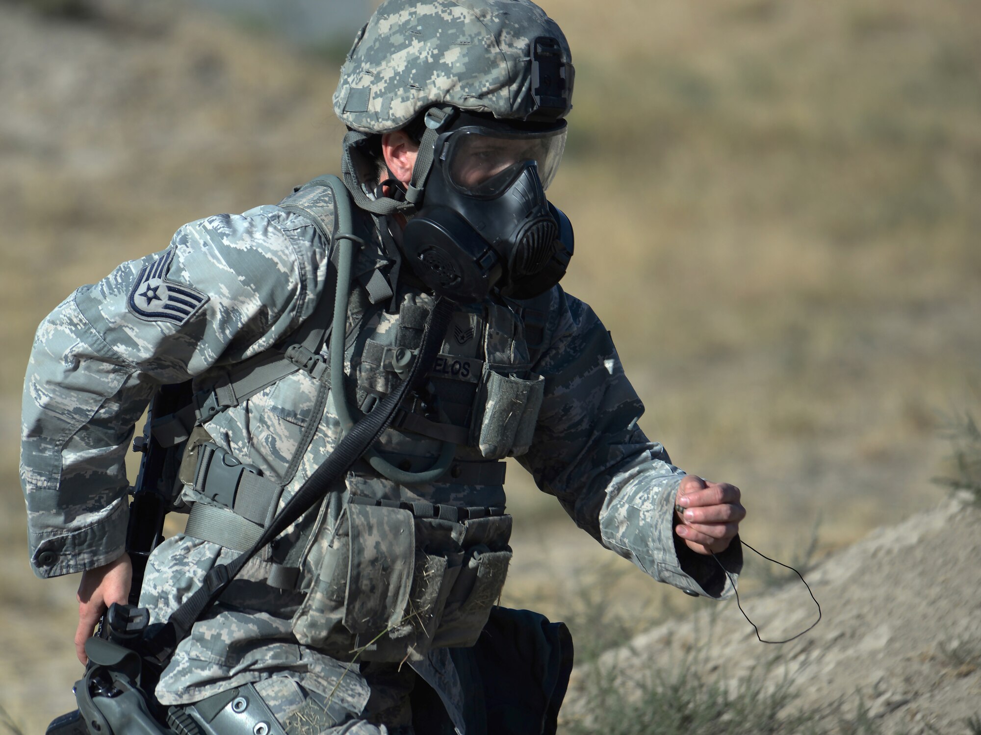 Staff Sgt. Kelly Stamelos, 7th Bomb Wing, Dyess Air Force Base, Texas, runs to the next shooting lane during the 2015 Global Strike Challenge security forces competition Sept. 22, 2015 on Camp Guernsey, Wyo. Ten security forces teams from eight Global Strike Command bases competed to determine which base trains the best of the best security forces. (U.S. Air Force photo by Senior Airman Brandon Valle)