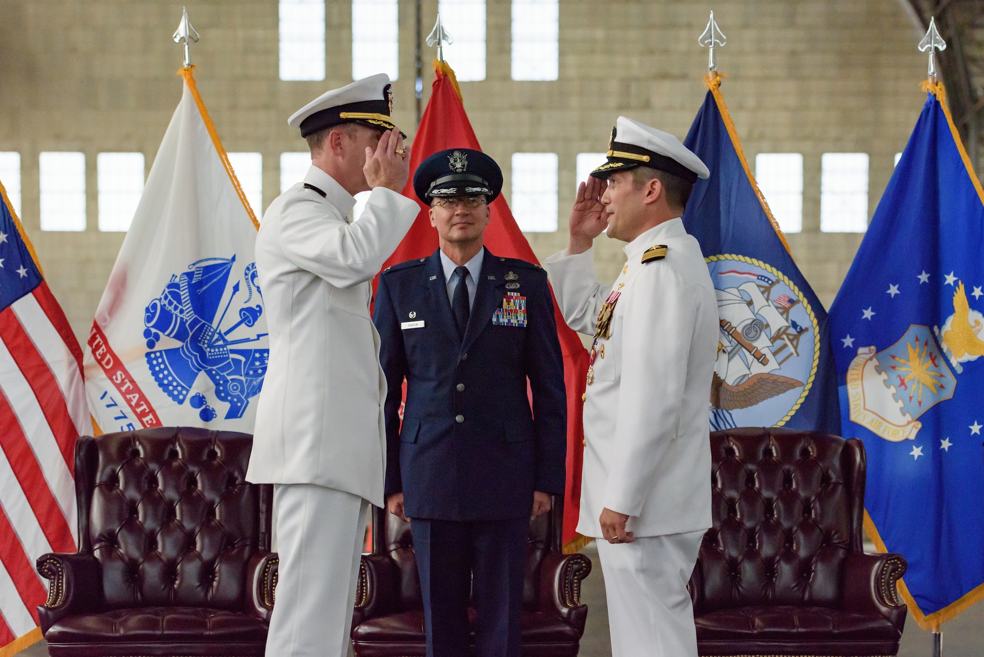 U.S. Navy Capt. Christopher Bergen (left) assumes command of Naval Support Activity-Lakehurst and responsibilities as Joint Base McGuire-Dix-Lakehurst Navy commander from Capt. Christopher J. Fletcher during a change of command ceremony officiated by Col. Frederick D. Thaden, JB MDL and 87th Air Base Wing commander, Sept. 25, 2015 at JB MDL, N.J. Fletcher and his family are moving to Austin, Texas, where they will start civilian life after more than 26 years of active-duty service. (U.S. Air Force photo by Robert Williard/Released)