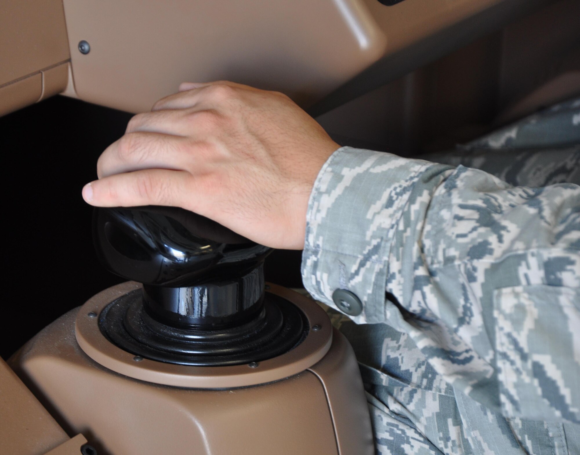 Senior Airman Yoonhong Min, 22nd Aerospace Medical Squadron bioenvironmental technician, tests the KC-46 Air Refueling Operator Station (AROS) Sept. 28, 2015, at McConnell Air Force Base, Kan. Boeing representatives visited McConnell for two days to give Airmen the opportunity to simulate an air refueling contact on a KC-46A Pegasus. Some of the features of the AROS include 24-inch displays for a 3D refueling picture, a 185-degree panoramic field-of-view, and recordable aerial refueling data and camera system. (U.S. Air Force photo by Tech. Sgt. Abigail Klein)